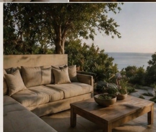 Outdoor lounge: linen sofa with ocean views, set among lush gardens